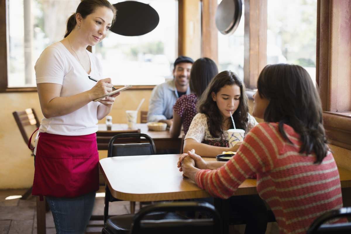 Representative Image Source: A Mexican waitress takes an order in a Taco stand. (Getty Images)