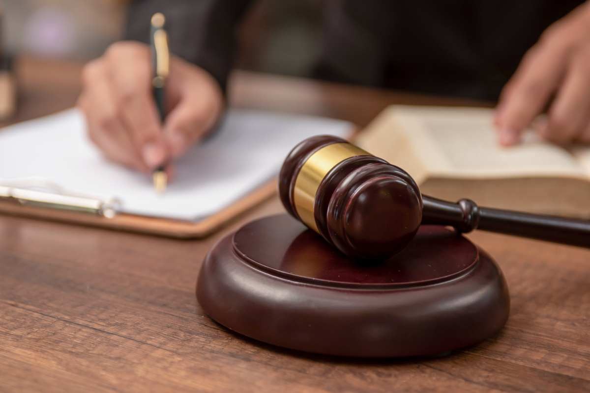 Representative Image Source: Male lawyer working with contract papers and wooden gavel on tabel in courtroom. justice and law ,attorney, court judge, concept. (Getty Images)