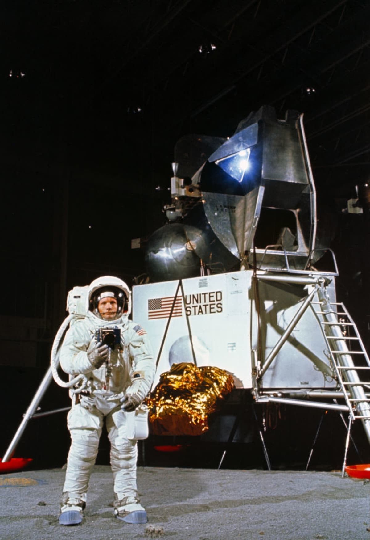 Neil Armstrong lunar surface training, USA, April 22, 1969. Astronaut Neil A. Armstrong, wearing an Extravehicular Mobility Unit, participates in a simulation of deploying and using lunar tools on the surface of the Moon during a training exercise in Building 9 at the NASA Manned Spacecraft Center (now Johnson Space Center) in Houston, Texas. In the background is the Lunar Module mock-up used for crew training. Three months after this photo was taken Armstrong would be on his way back from the Moon - having been the first human to set foot on the Moon during the Apollo 11 mission in July 1969. Artist NASA. (Photo by Heritage Space/Heritage Images via Getty Images)