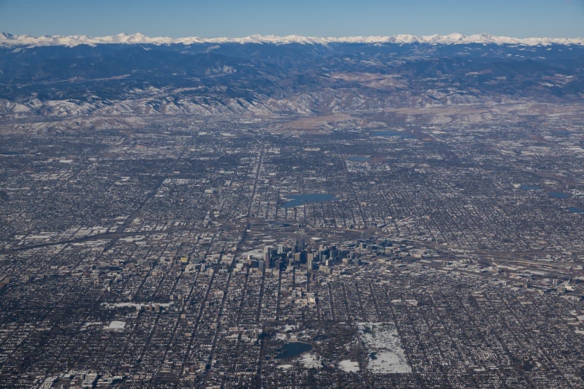 Image Source:  An aerial view downtown Denver, Colorado. (Photo by Kevin Carter/Getty Images)