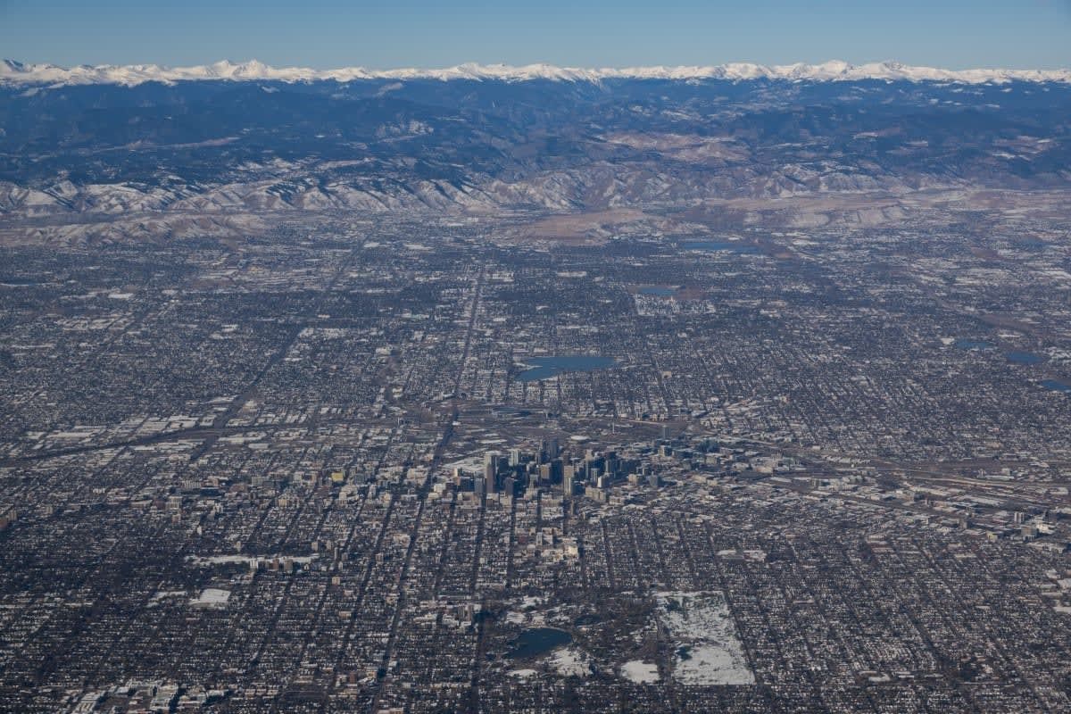 Image Source: An aerial view downtown Denver, Colorado. (Photo by Kevin Carter/Getty Images)