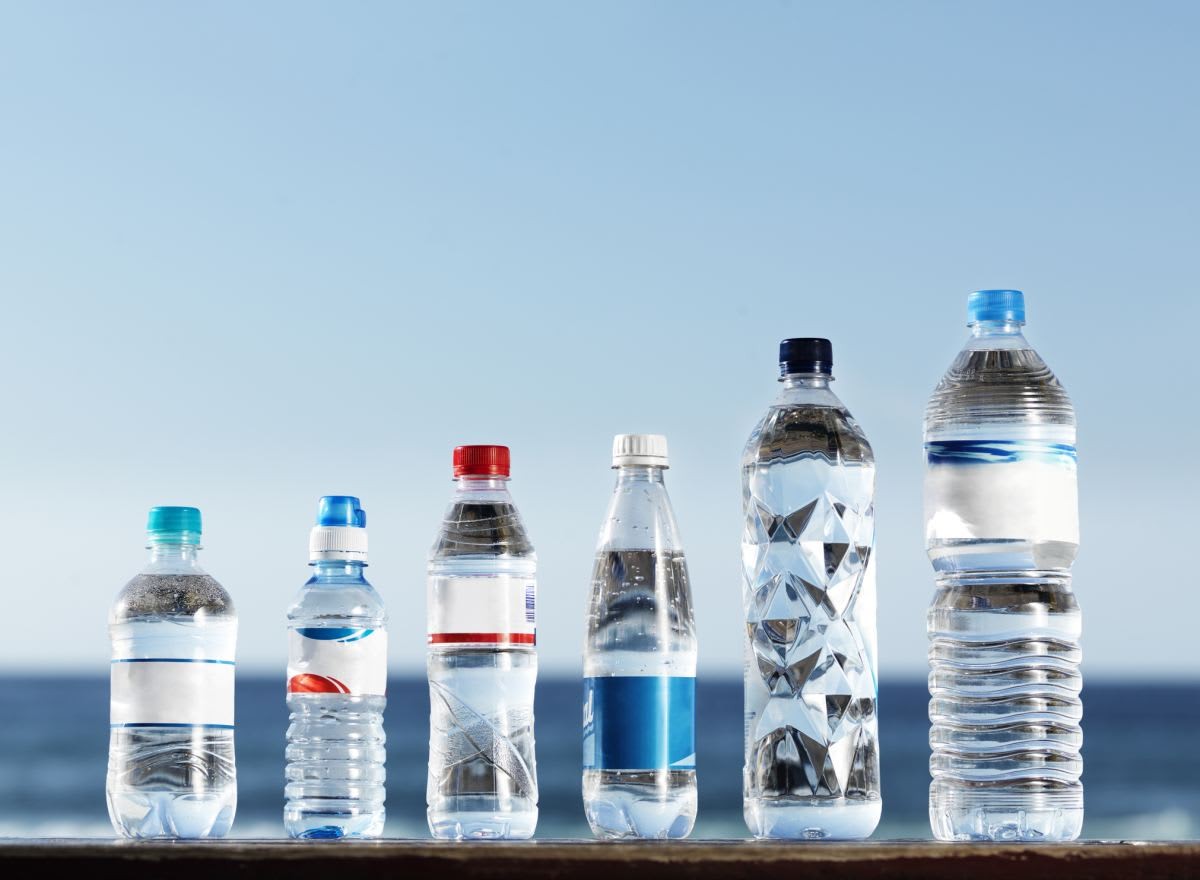 Representative Image Source: Standing on a wooden surface, an assortment of various sizes and shapes of water plastic bottles, ranging from small to large and fat to slim (Getty Images)