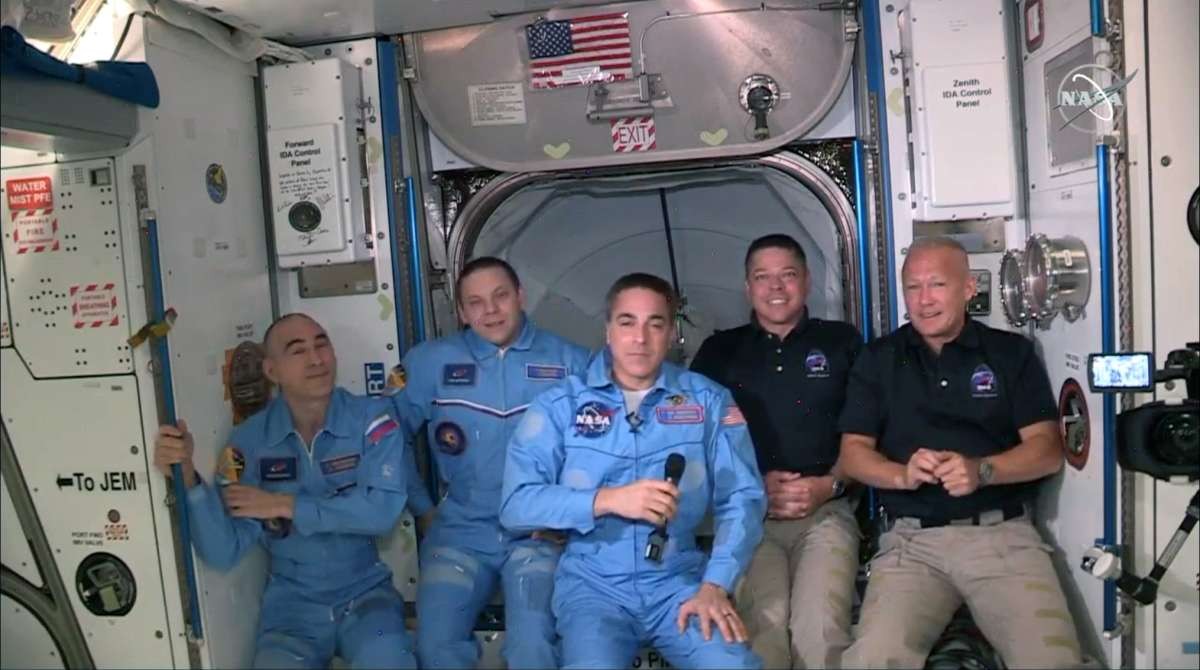 Image Source: NASA astronauts Doug Hurley (R) and Bob Behnken (2R) join NASA astronaut Chris Cassidy (C) and Russian cosmonauts, Anatoly Ivanishin (L) and Ivan Vagner (2L) aboard International Space Station. (Photo by NASA via Getty Images)