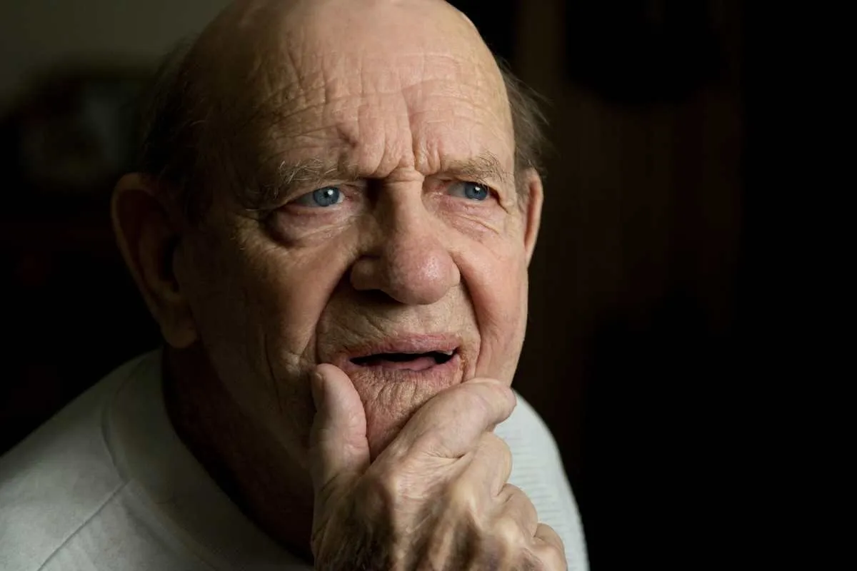 Elderly man hand on chin in deep thought (Representative Image Source: Getty Images | John Rob)