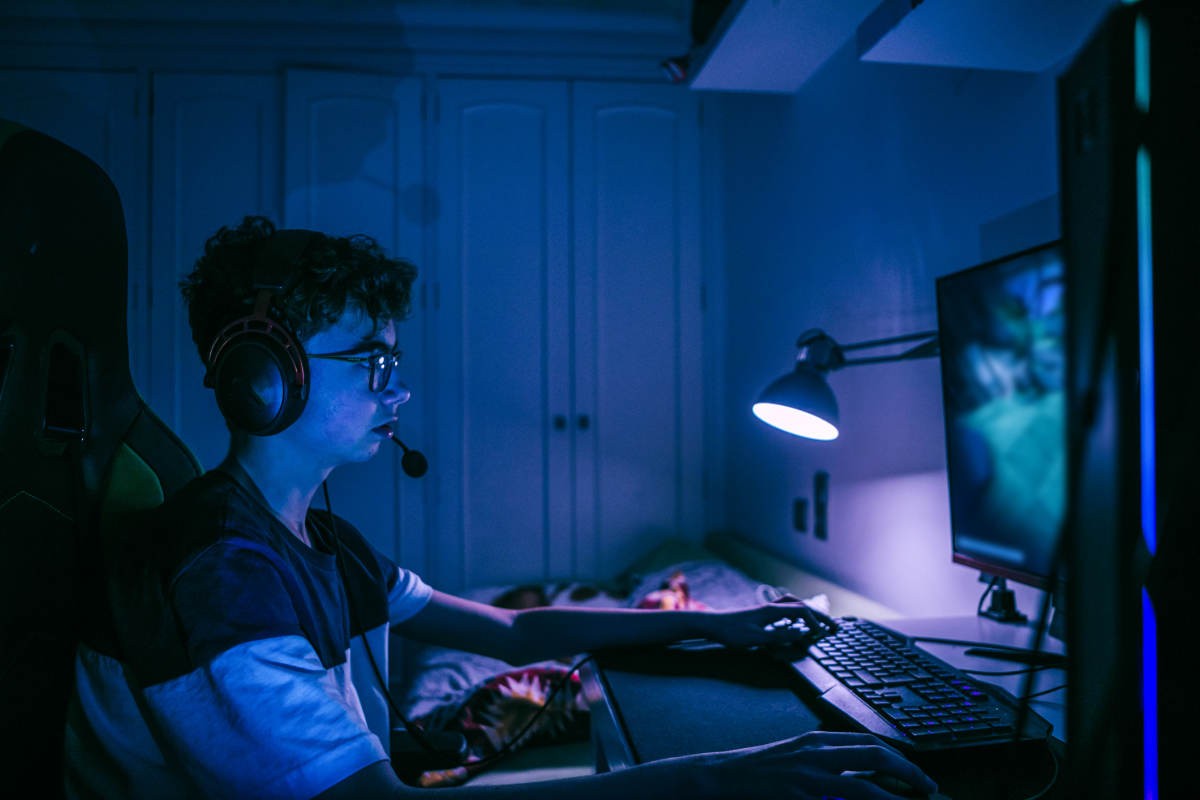Close up image of gamer tenager boy playing pc games with headset (Representative Image Source: Getty Images | Photo by Carol Yepes)