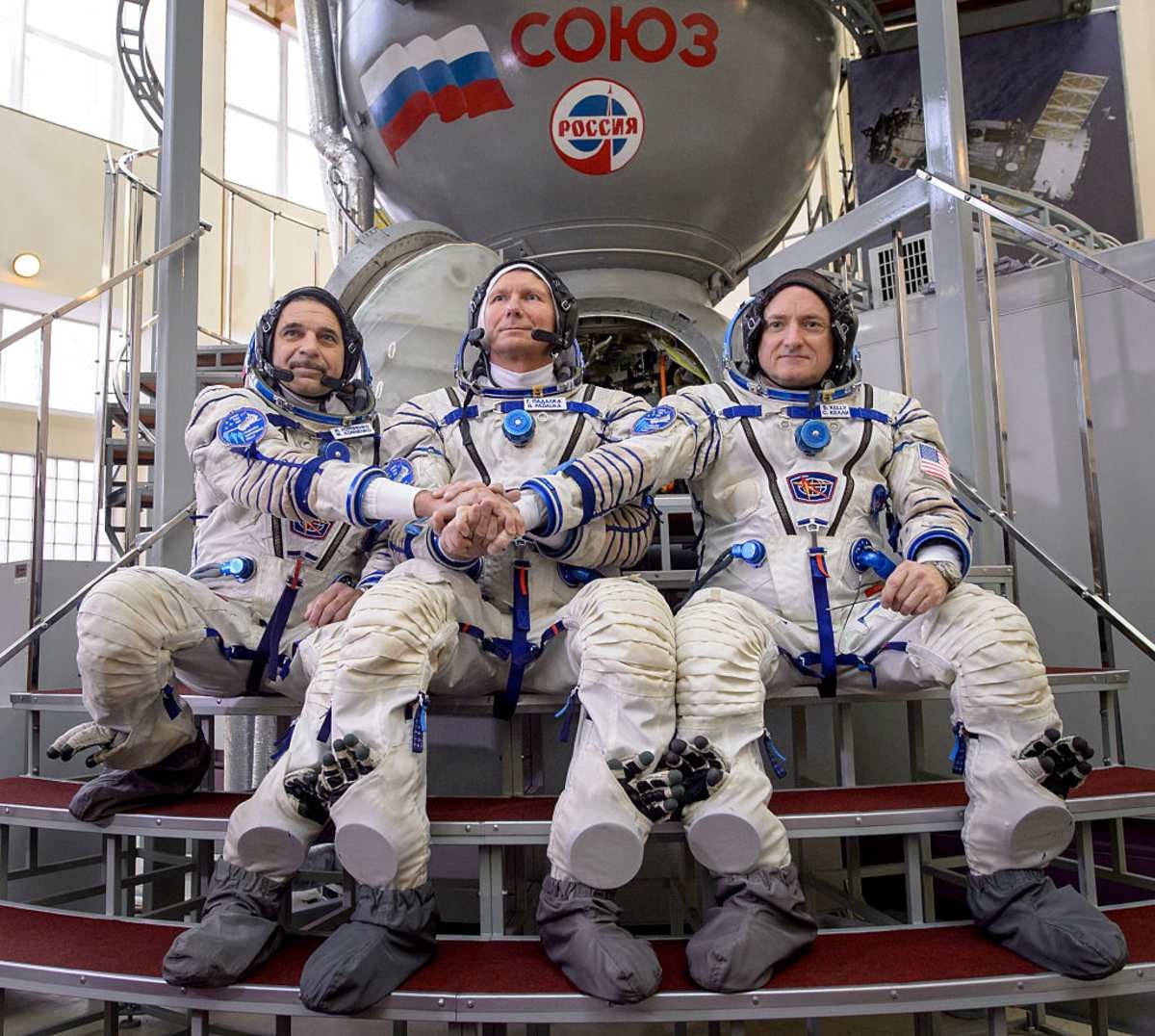 Image Source: Expedition 43 Russian cosmonaut Mikhail Kornienko of the Russian Federal Space Agency (Roscosmos), Russian cosmonaut Gennady Padalka of Roscosmos and NASA Astronaut Scott Kelly. (Photo by /Bill Ingalls/NASA via Getty Images)
