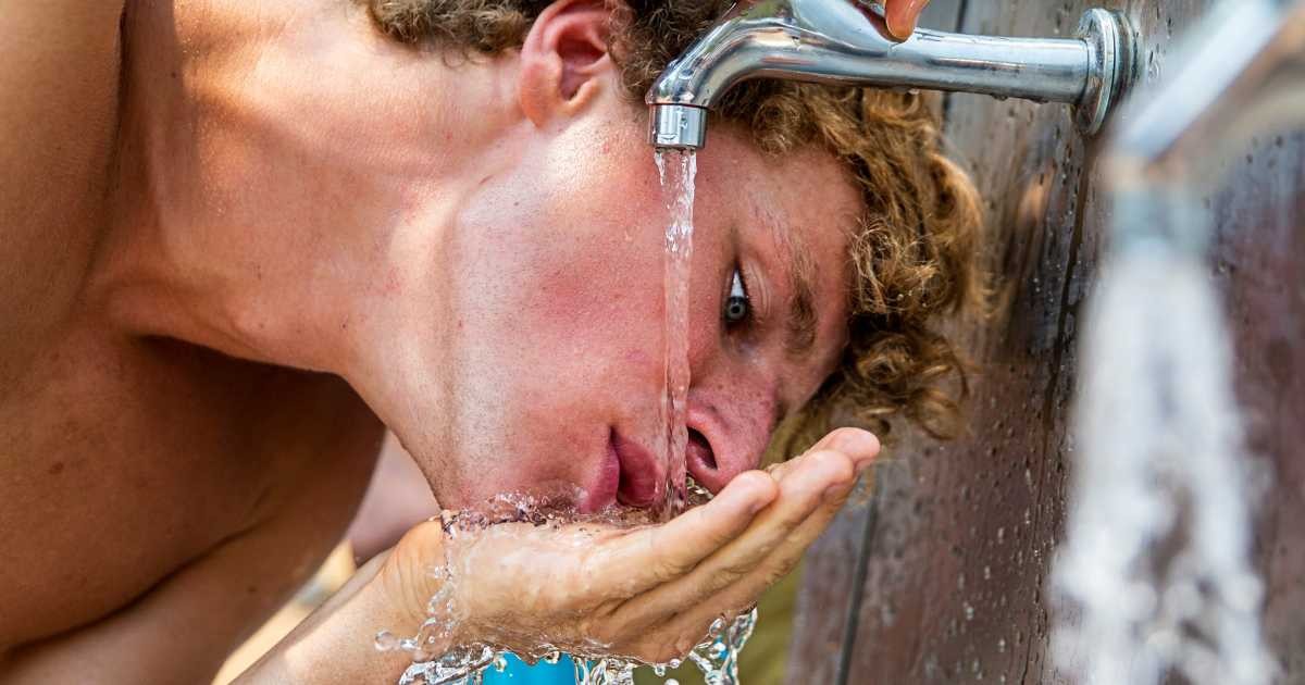Representative Image Source: A man drinks water from a tap during hot conditions at Mrs Macquarie's Chair to watch the fireworks during New Year's Eve celebrations on December 31, 2019 in Sydney, Australia. (Photo by Jenny Evans/Getty Images)
