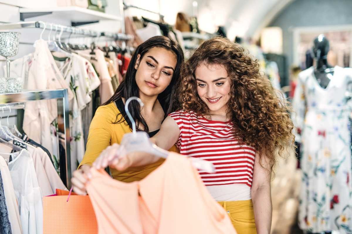 Representative Image Source: Two female teenager friends standing inside in the shop, holding and looking at dress (Getty Images)