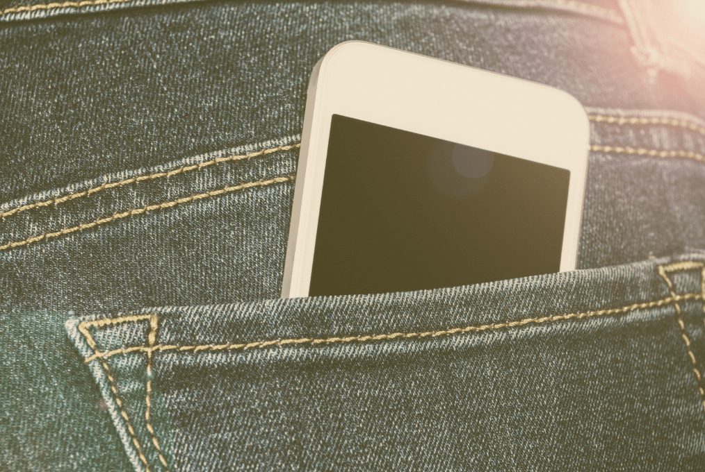 smart phone in jeans pocket