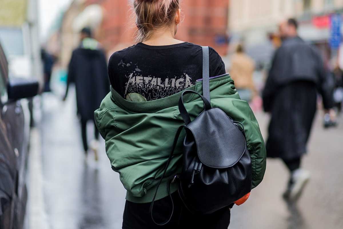 Image Source: A guest wearing a black Metallica t-shirt, olive bomber jacket, and black backpack outside Stylein during the Stockholm Fashion Week Spring/Summer 2017 on August 29, 2016. (Photo by Christian Vierig/Getty Images)