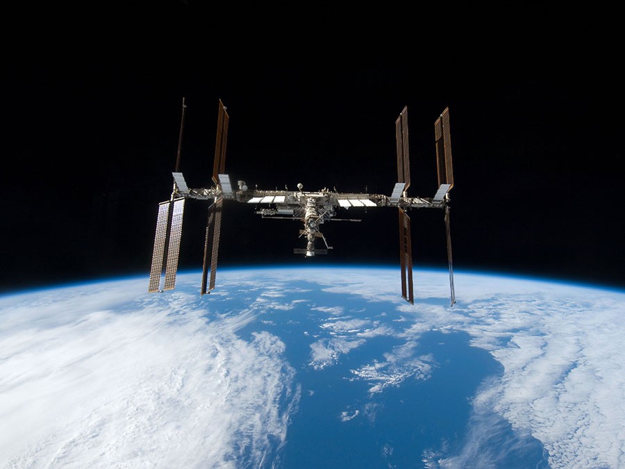 spacecraft hovering over earth