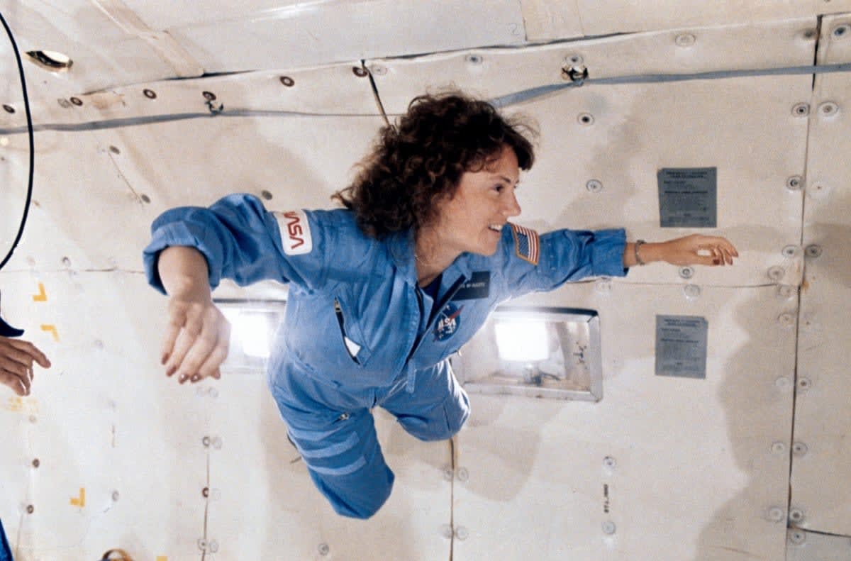 Image Source: Christa McAuliffe during a microgravity flight aboard NASA's KC-135 zero-gravity aircraft, January 8, 1986. Image courtesy National Aeronautics and Space Administration (NASA). (Photo by Smith Collection/Gado/Getty Images)