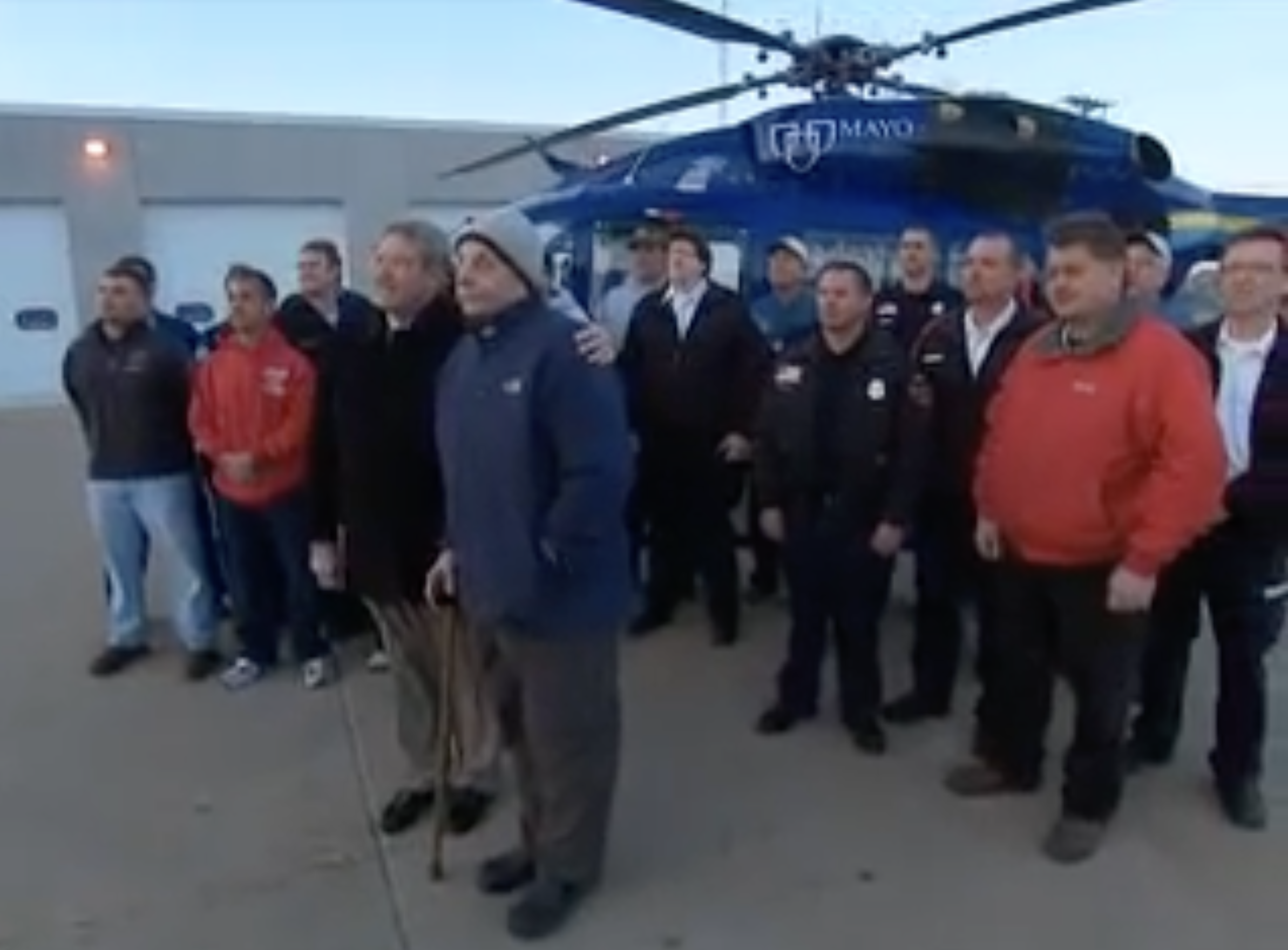Howard Snitzer posing for a photo with some of the people who helped saved his life