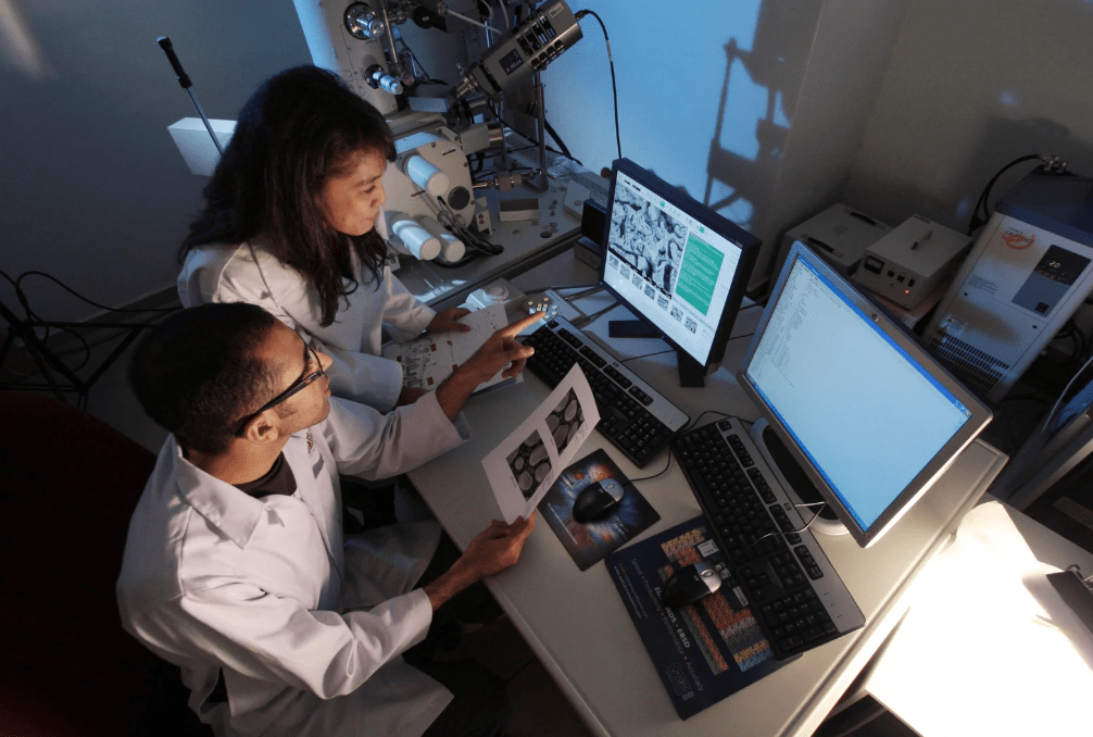 Scientists testing with a computer