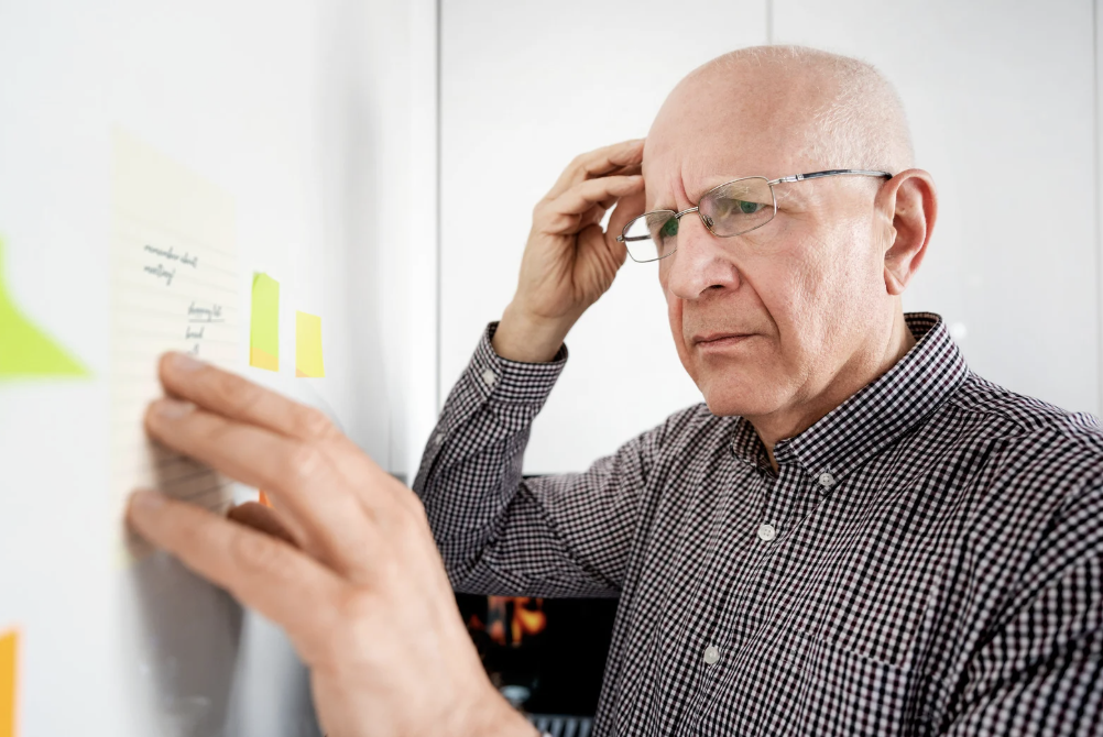 Older man forgetting something.