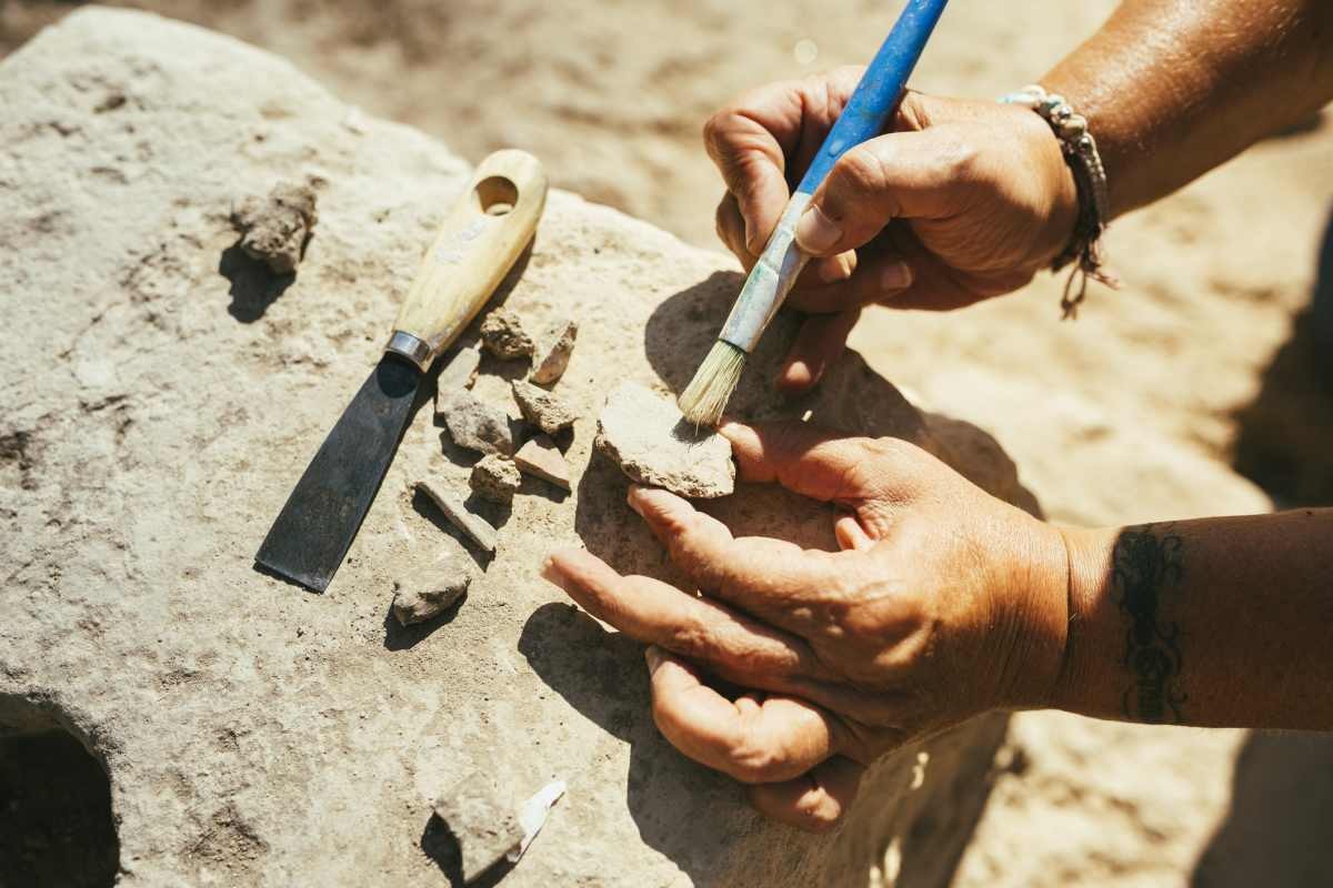 Representative Image Source: Woman's hands using a brush to clean up a piece of ancient pottery on an archaeological site (Getty Images)