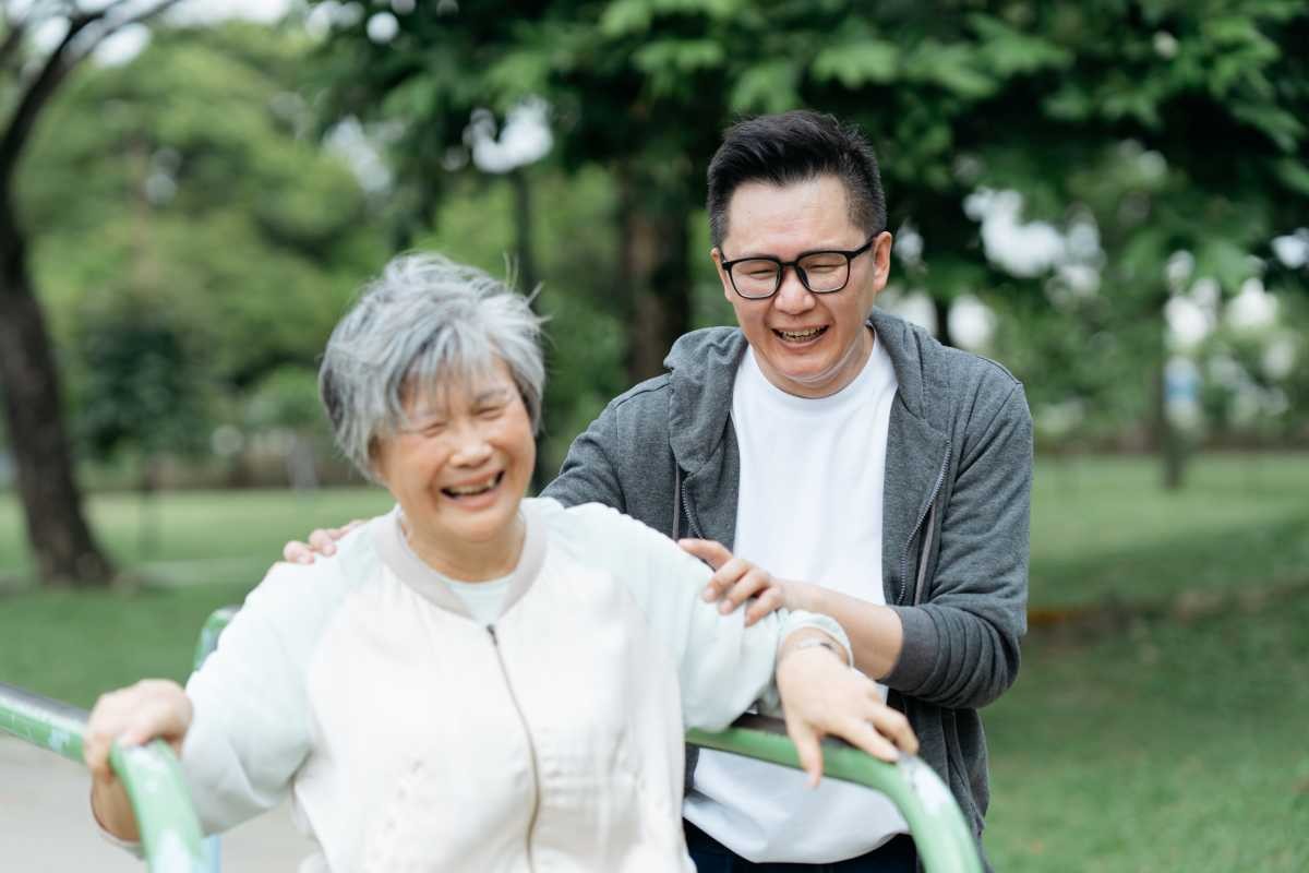 Representative Image Source: Happy Asian senior woman is exercise on outdoor play equipment with her son (Photo by hxyume for Getty Images)