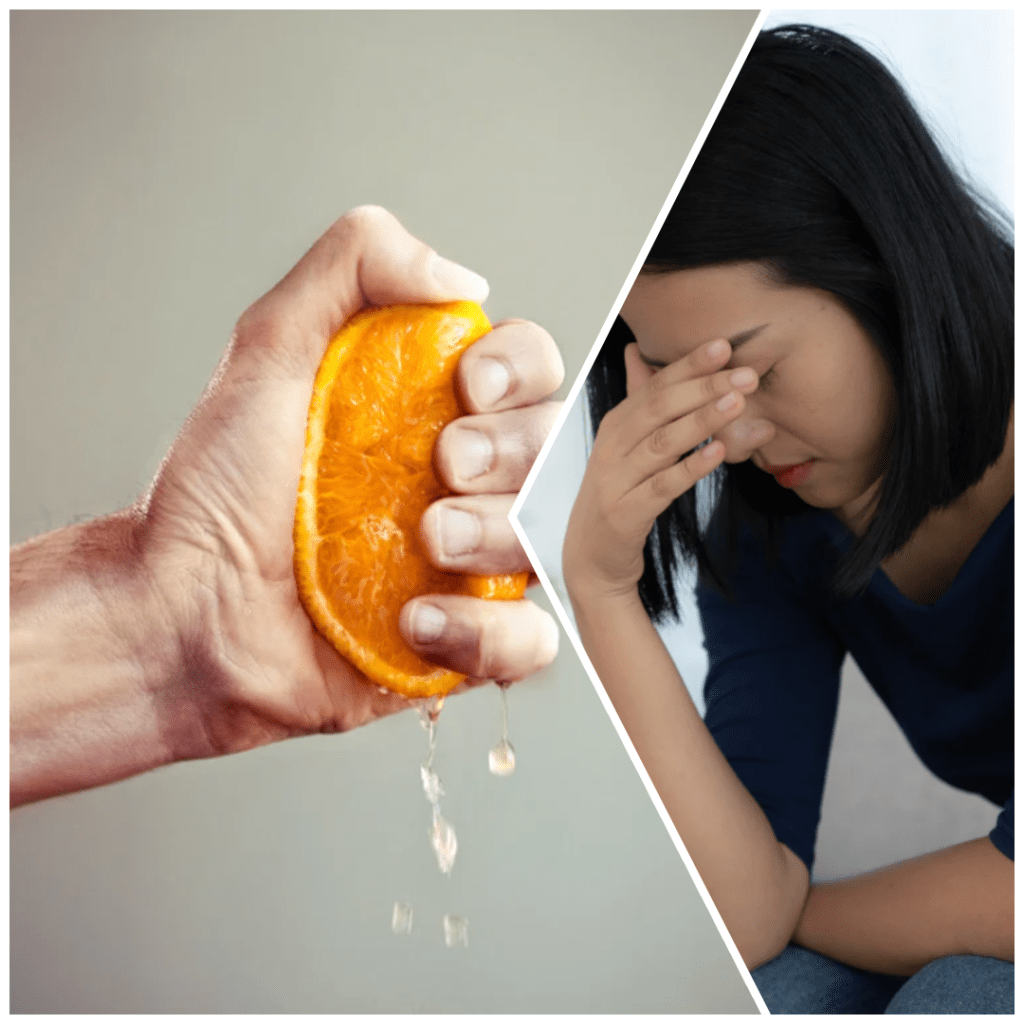 Hand squeezing orange/depressed woman