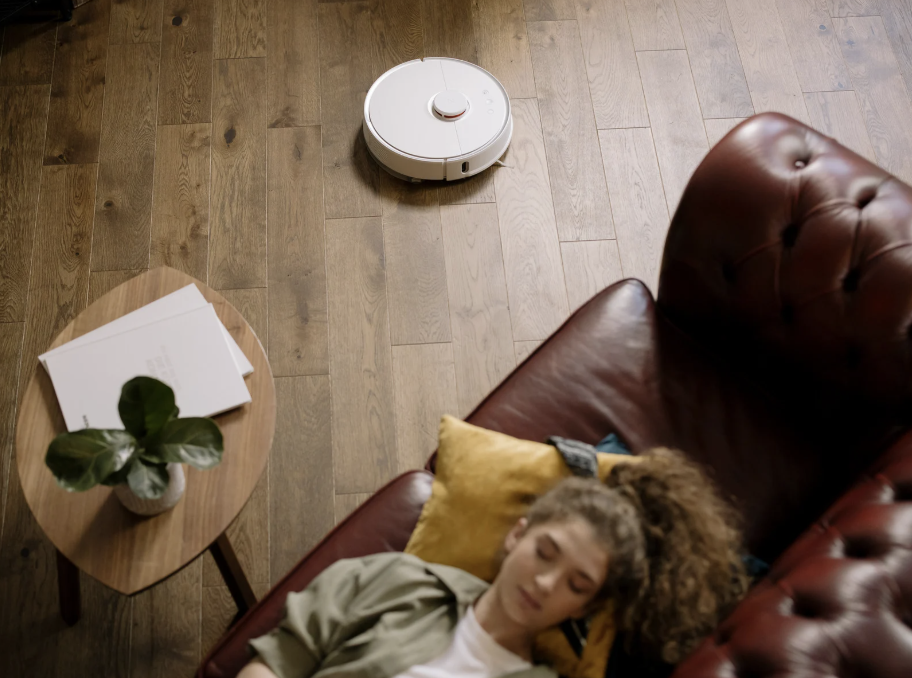 roomba, shark vacuum, woman napping, sweeping, clean house