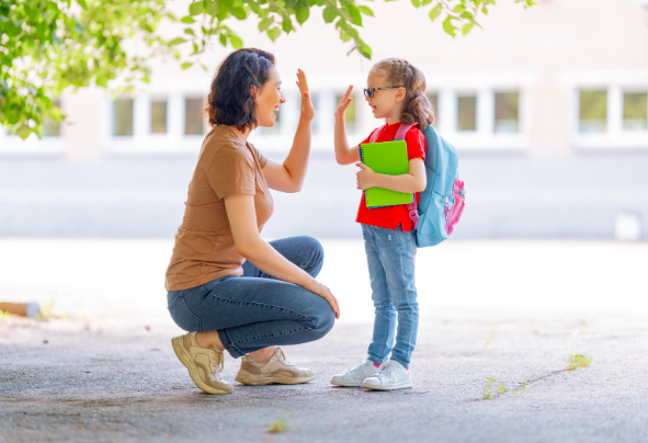 Mom, daughter, high five, parenting, parents, kids