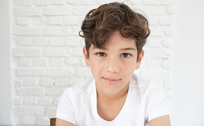 young boy, serious young boy, seven year old, brown hair, healthy kid