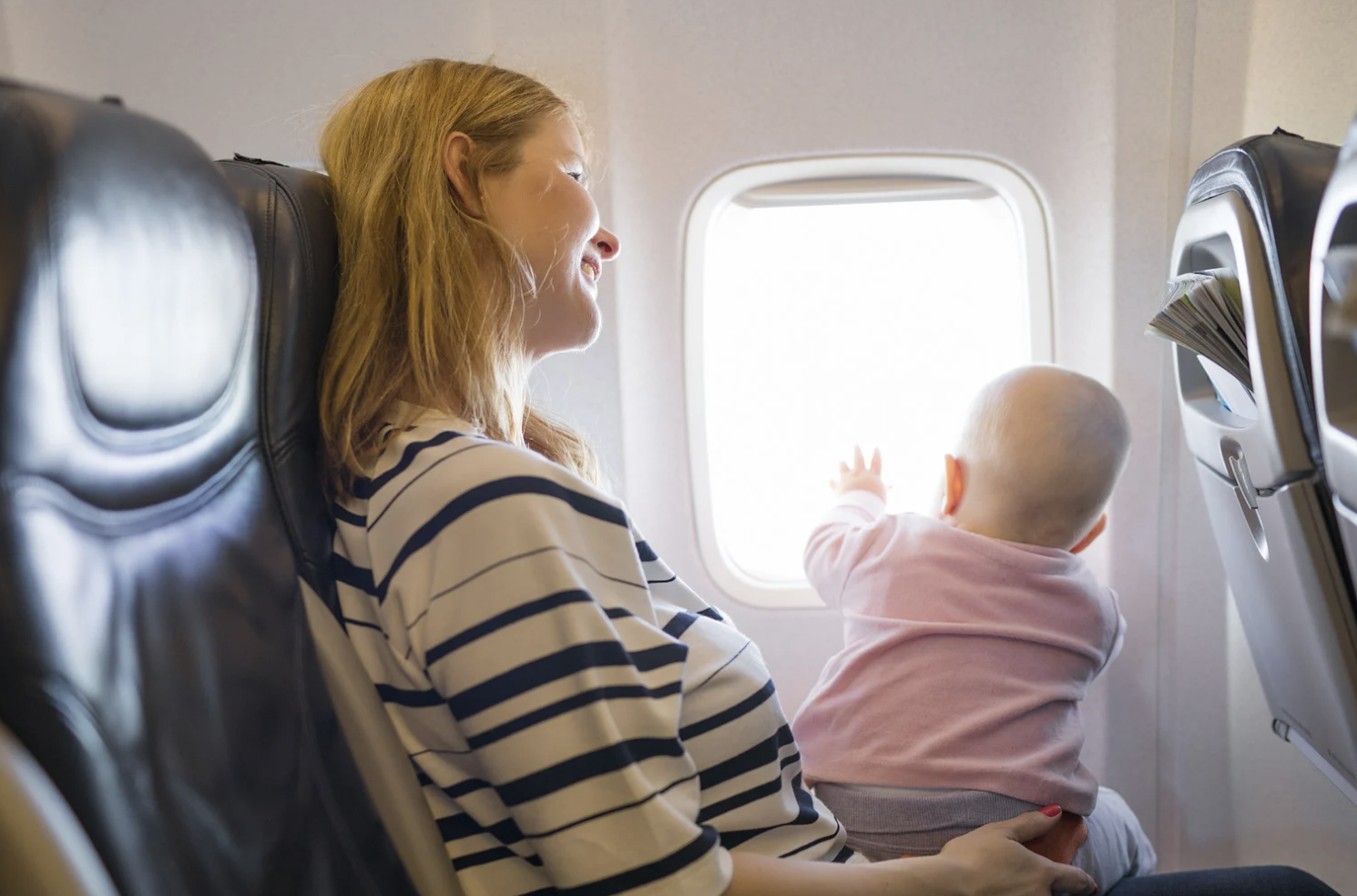 airplane etiquette, seat-swap, flying with kids, Mumsnet, travel debate, parenting, passenger rights, family travel, airline seats, viral post