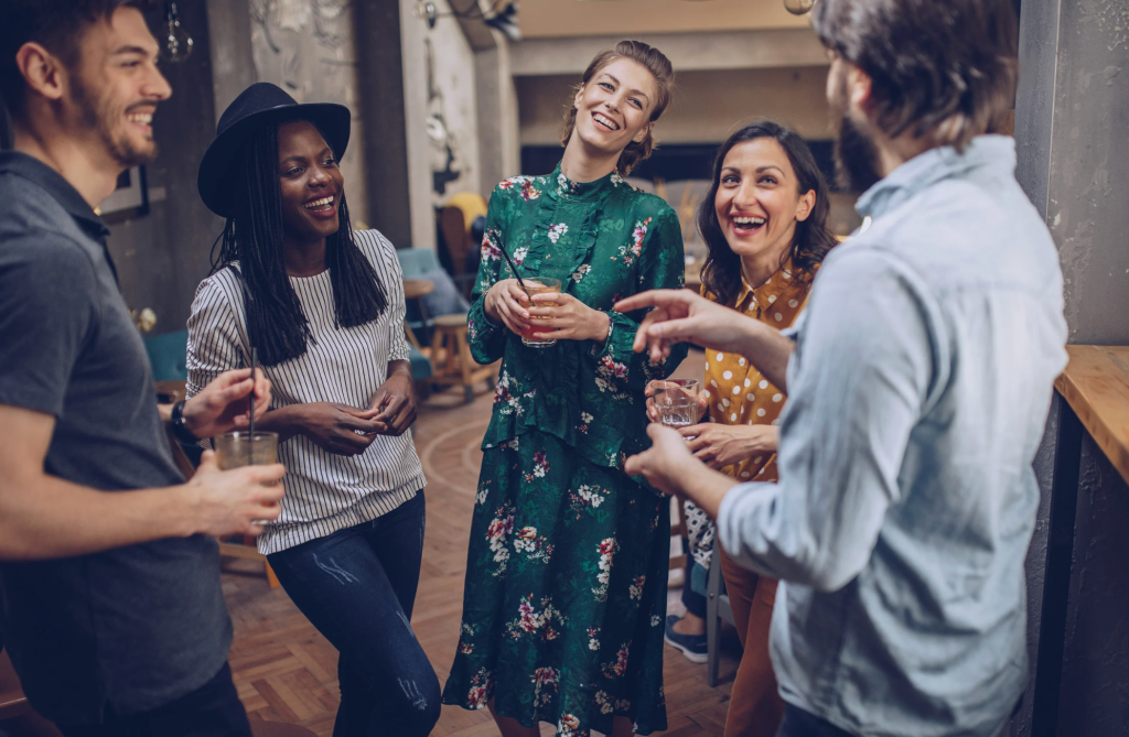 body language tips, how to be likable, nonverbal communication, mirroring psychology, eye contact rules, Duchenne smile, improve social skills, first impressions