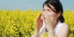 A girl in a field of flowers.