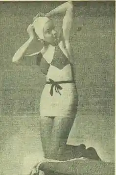 A woman in a one-piece bathing suit.