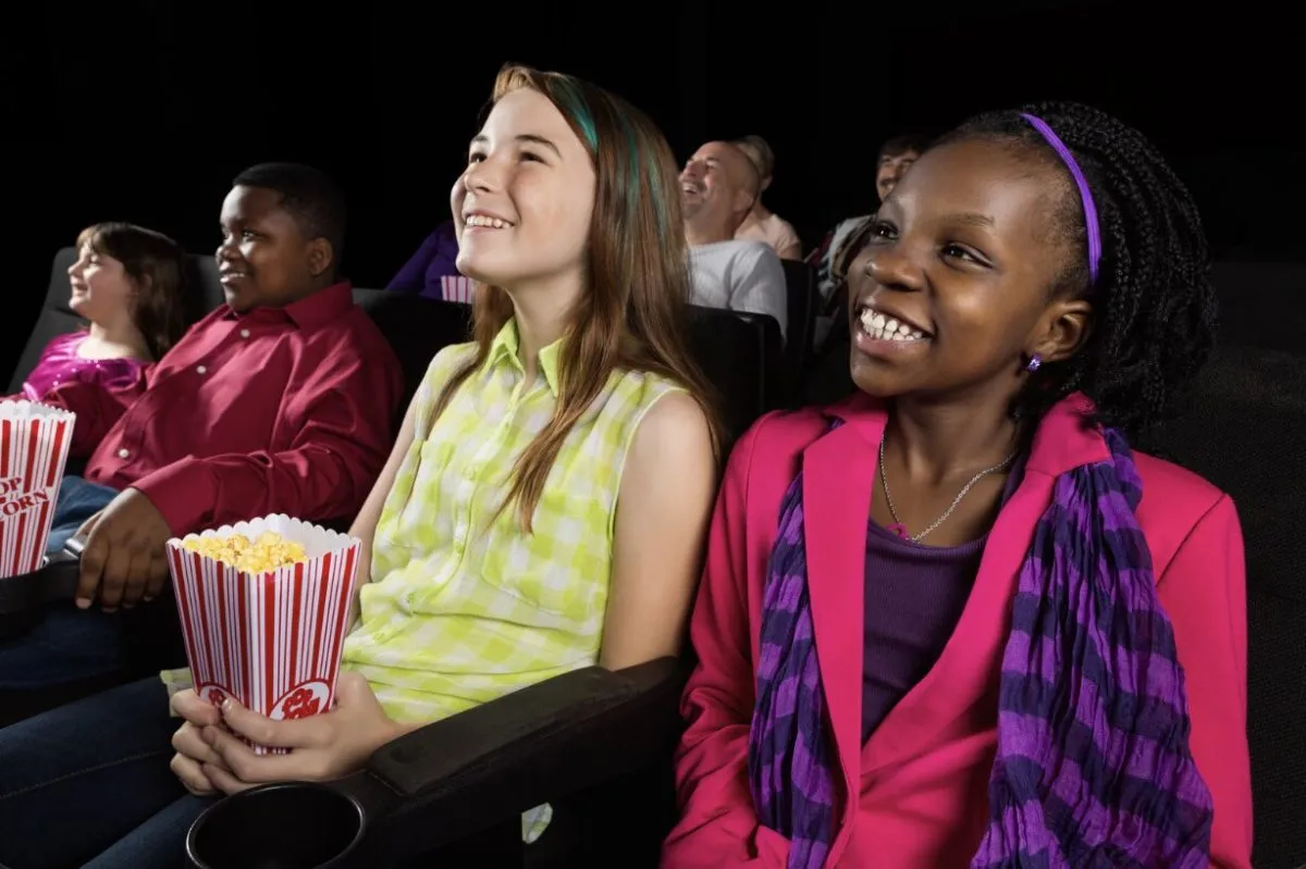 After a field trip for 100 low-income kids was canceled, police officer rents a whole movie theater for them