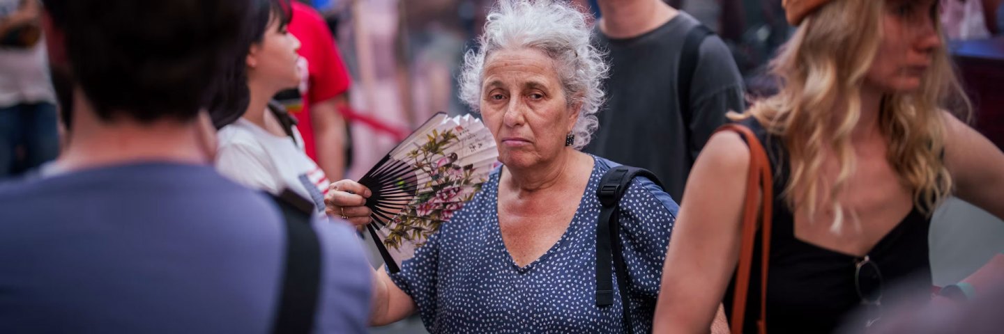 Extreme heat can become lethal quickly. A woman fans herself while waiting in line to buy Broadway show tickets during a heat advisory in New York’s Times Square in May 2026.